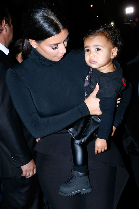Making her first-ever Fashion Week appearance, North sports an all-black ensemble to Balenciagas front row during the Spring 2015 collections in Paris.