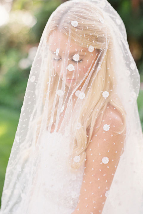 Polka dots are a beautiful, whimsical thing, especially when paired with a classic veil.

