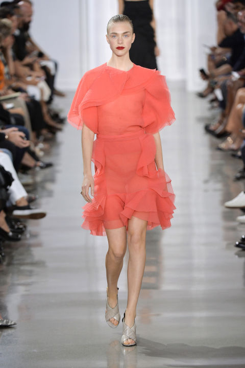 Wu's dresses let loose the flou, with ruffles and frills piled on top of vibrant pink. But you could still imagine this hanging in the same closet as a sexy sheer black lace cami and tulle skirt that preceded. There's always two sides to a story, right?