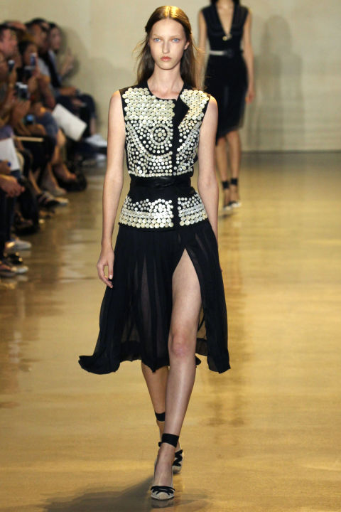 The best part was that the thigh-high slits weren't the news here, though much has been made of them of late on social media. They're Altuzarra's signature, sure, but not his only game. Pleated dresses and skirts in burnt reds and oranges, trim pant suits and cinched slim dresses with open necklines slightly tugged off the shoulders rounded out his runway. And it all ended on a very detailed evening note where he painstakingly jeweled and beaded white gauze dresses and black tunics and skirts. Shifting the focus yet again.