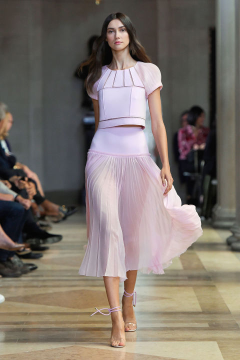 But happiness and design chops are not mutually exclusive. Herrera showed cut-out looks throughout the lineup—tops, skirts and dresses whose sheer thin lines offered keen visual interest and grounded the cotton candy prettiness.