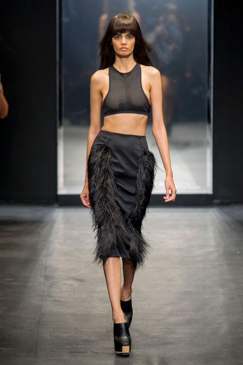 Feathers, fringe, sequins (in blue and burnished copper) covered everything in Wang's evening message. Even if that message was about being brief—bared midriffs, negligees, slips and halter dresses.