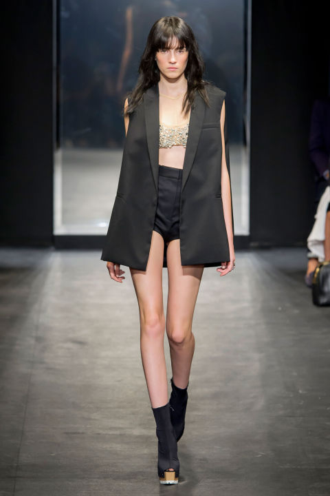 Wang mixed sporty bras and briefs with tuxedo vests and men's blazers. And every once in a while, she threw in a tailored skirt or button-down blouse with extra volume in sheer gauze. There were hints of shine, too, in spangled tube tops.