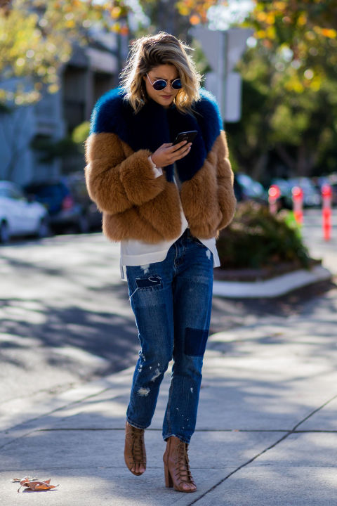 Create a high glam/low effort mix by throwing on a plush fur coat over a basic tee and jeans. <br />