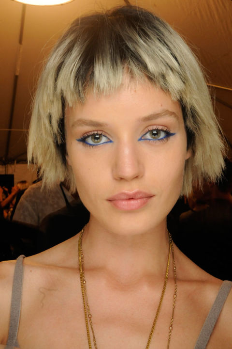 Makeup artist Francois Nars only did one show at New York Fashion Week—so naturally, he made it count, giving models edgy and unforgettable cat eyes in a rich teal shade (NARS Eyeliner Pencil in Kalisté, to be exact.) "This is a summer look that's all about the eye," he said. "Most of the girls have a teal blue line, but some have royal blue, extending past both the inner and outer corner." Redken hairstylist Guido Palau followed suit, tricking models out in punky wigs with jagged, irregular cuts.